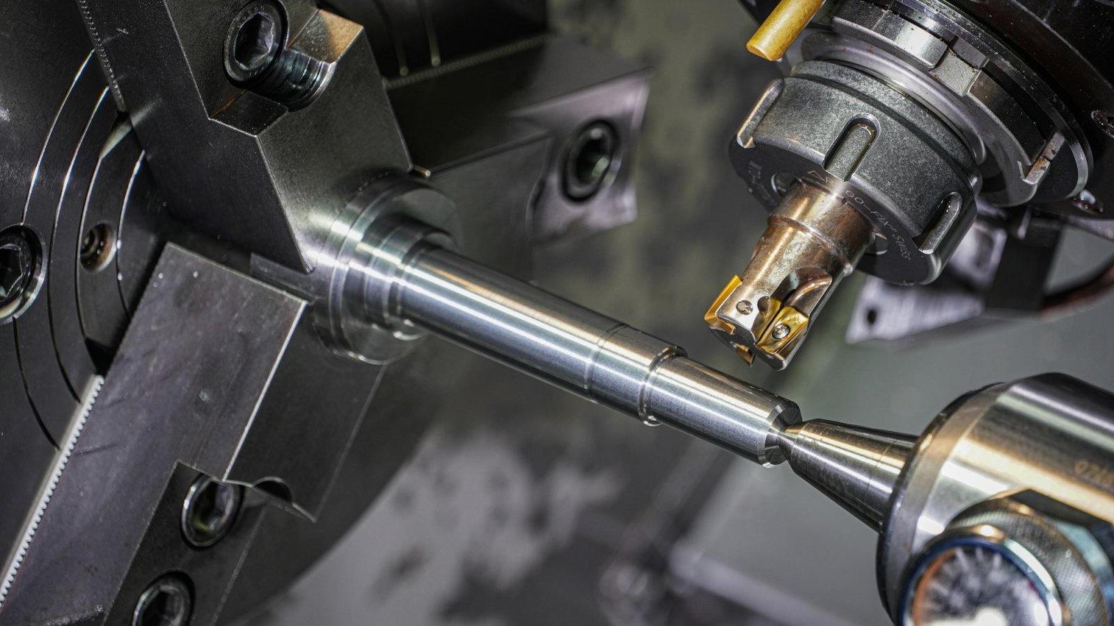 Precision turning on a lathe, illustrating the machining work done at Glass Components, Inc. in Union City, Indiana